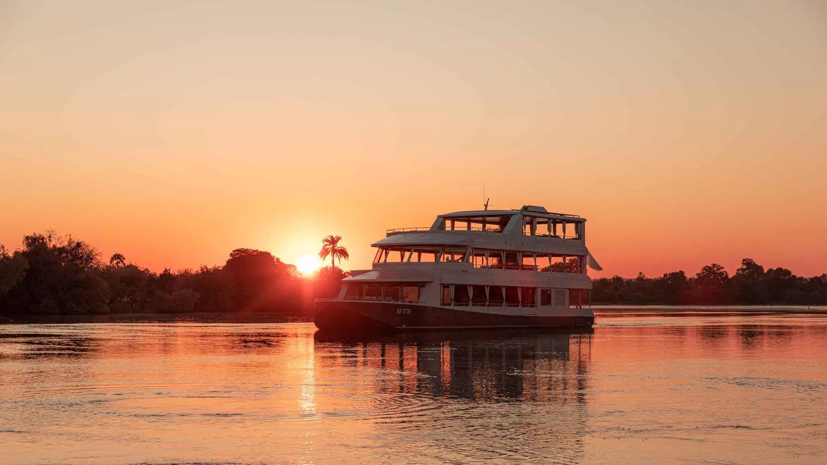 The Zambezi Explorer cruise boat at sunset on a Zambezi River tour above Victoria Falls