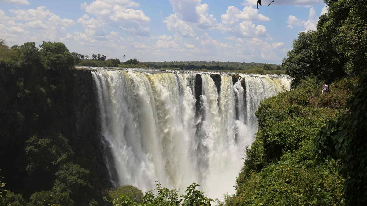 Spray over Victoria Falls seen on a guided tour that pairs with Zambezi River tours
